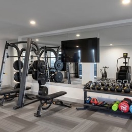 fitness center with open spaces and bright lighting through the windows